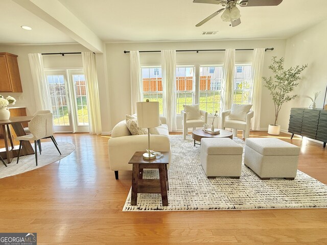 spare room with crown molding, baseboards, a tray ceiling, carpet flooring, and arched walkways