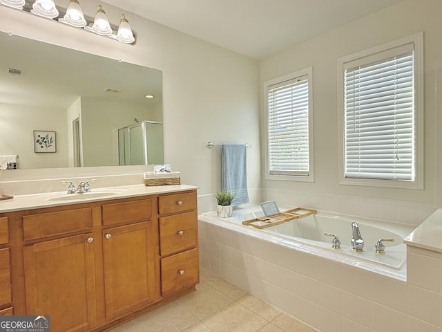 bathroom featuring tile patterned floors, shower / washtub combination, toilet, and a sink