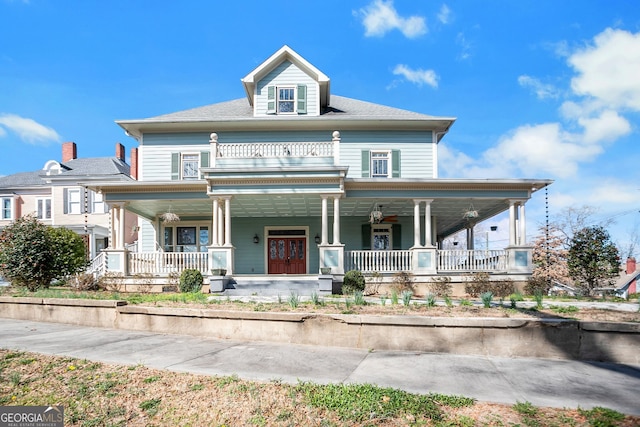 view of front of house featuring a porch and a balcony