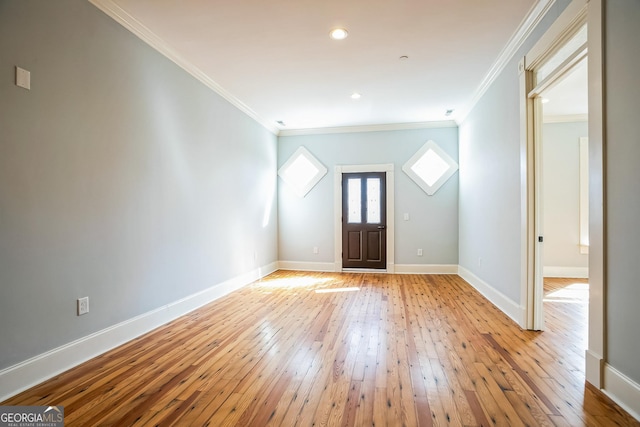 entrance foyer with recessed lighting, light wood-type flooring, baseboards, and crown molding