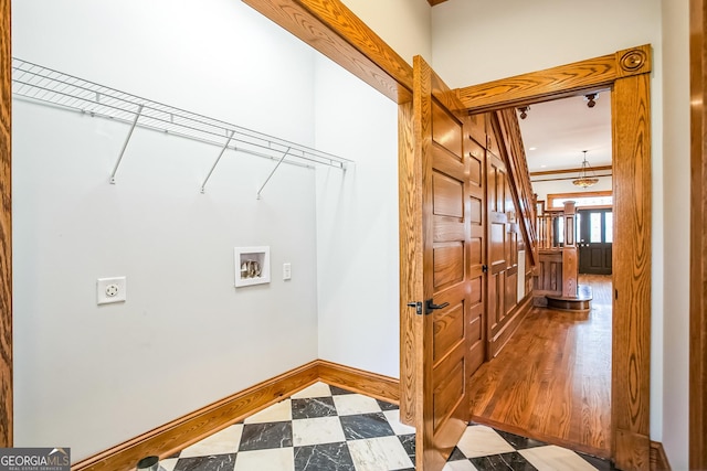 washroom featuring baseboards, laundry area, hookup for a washing machine, tile patterned floors, and hookup for an electric dryer