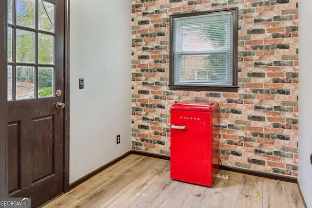 interior space with baseboards and hardwood / wood-style floors