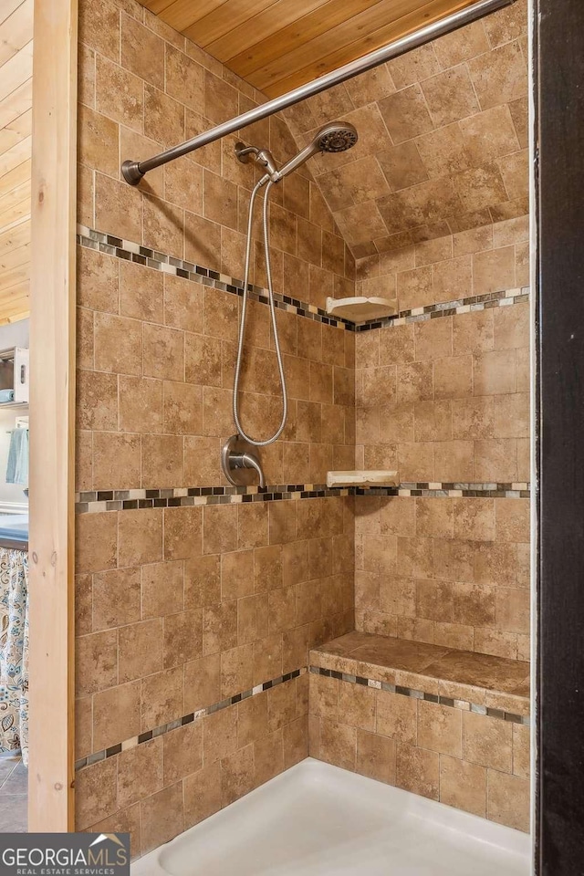 bathroom featuring a tile shower