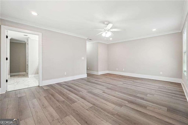 unfurnished room with crown molding, baseboards, and ceiling fan