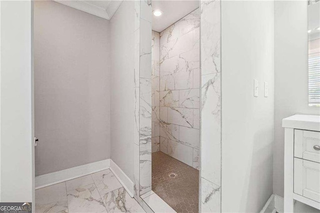 full bath featuring a walk in shower, crown molding, baseboards, marble finish floor, and vanity