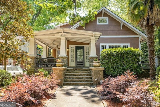 craftsman house with a porch and a ceiling fan