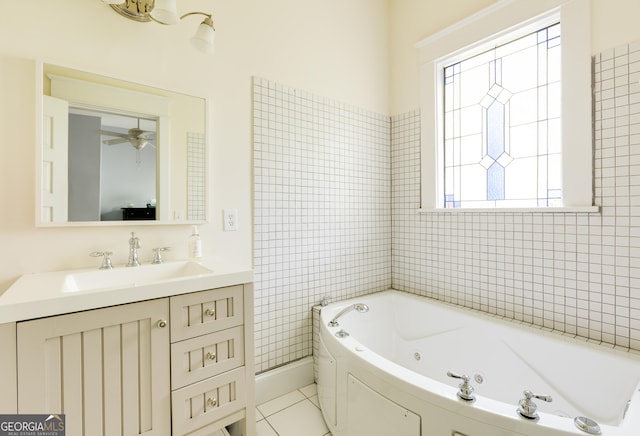 bathroom featuring vanity, a whirlpool tub, and tile patterned flooring