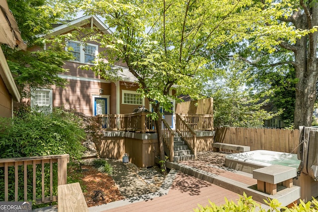 wooden deck featuring fence