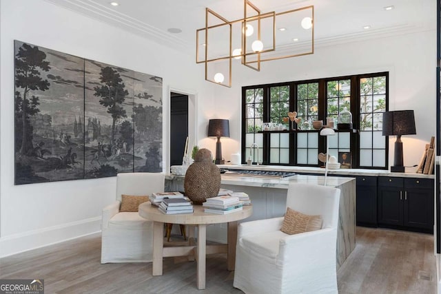 interior space featuring recessed lighting, light wood-style flooring, baseboards, and ornamental molding