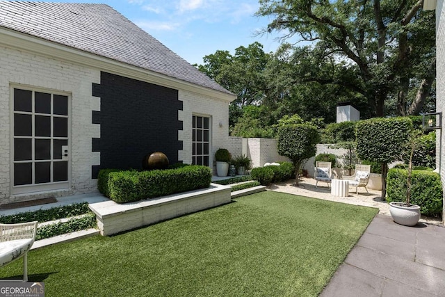 view of yard featuring a patio and fence