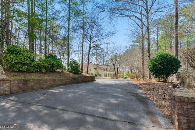 view of street featuring aphalt driveway