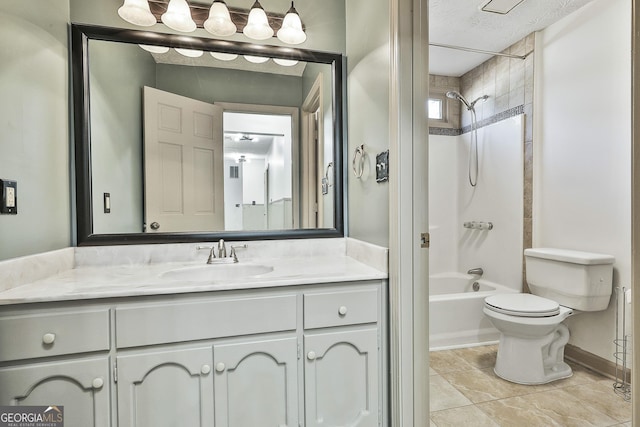 full bathroom featuring tile patterned floors, toilet, a textured ceiling, bathtub / shower combination, and vanity