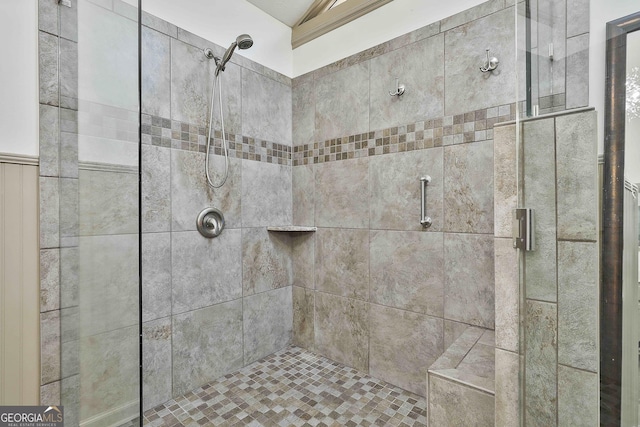 full bath featuring a shower stall