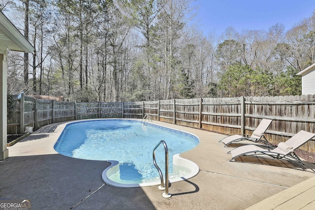 view of swimming pool featuring a fenced backyard, a fenced in pool, and a patio