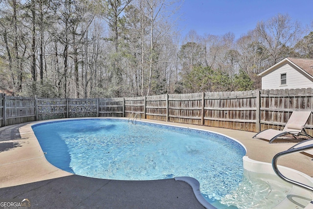 view of swimming pool with a fenced in pool, a patio, and a fenced backyard