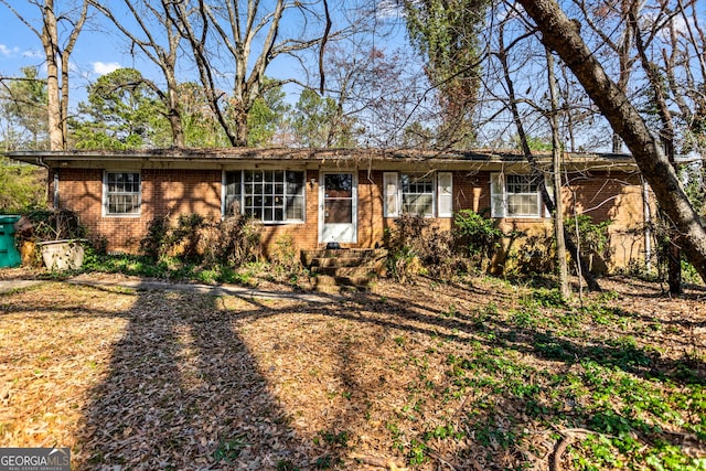 single story home with brick siding