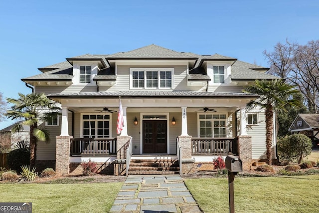 prairie-style home featuring a porch, a front lawn, and ceiling fan