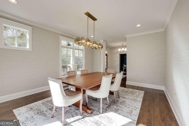 dining area with wallpapered walls, baseboards, and ornamental molding