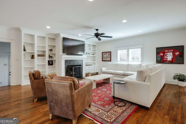 living room featuring dark wood finished floors, recessed lighting, a fireplace, and ceiling fan