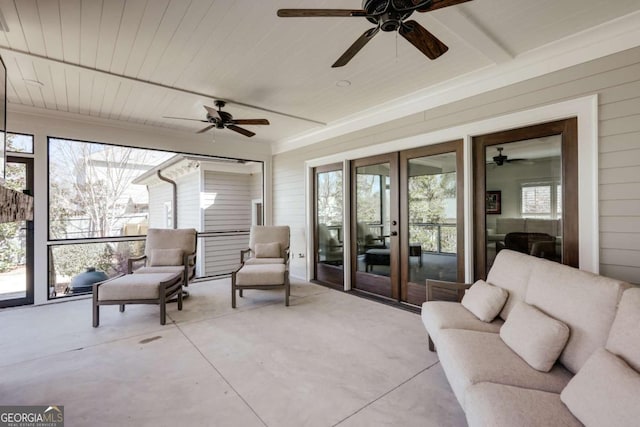 sunroom featuring plenty of natural light and wood ceiling