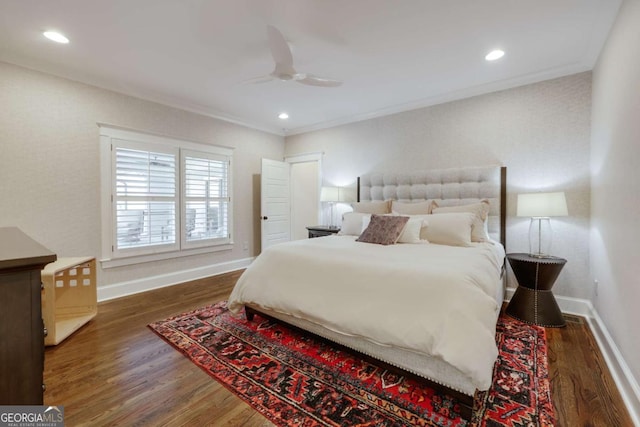 bedroom with recessed lighting, crown molding, baseboards, and wood finished floors