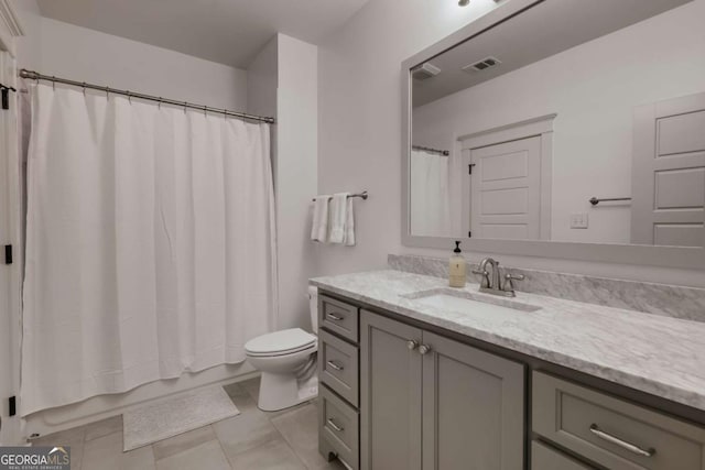 bathroom with visible vents, toilet, shower / tub combo with curtain, and vanity