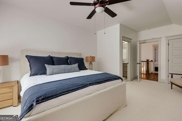 bedroom featuring lofted ceiling, carpet, and a ceiling fan