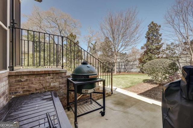 view of patio with a grill and a fenced backyard