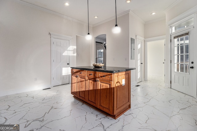 kitchen featuring baseboards, ornamental molding, recessed lighting, brown cabinetry, and marble finish floor