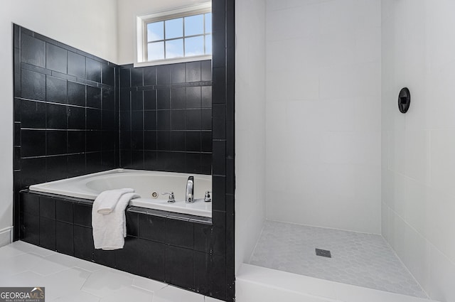 full bathroom with a tile shower and a whirlpool tub