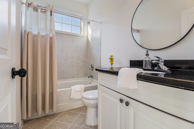 full bath with tile patterned flooring, toilet, vanity, and shower / bath combo with shower curtain