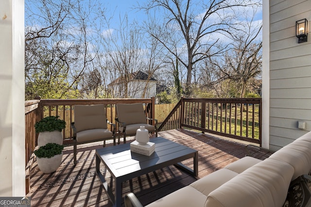 wooden terrace featuring an outdoor hangout area