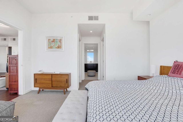 bedroom featuring visible vents, carpet floors, and baseboards