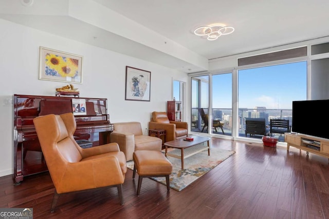 living room with floor to ceiling windows and hardwood / wood-style flooring