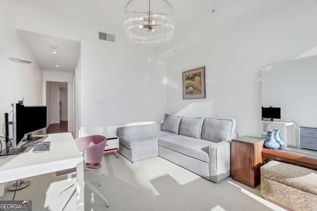 living area featuring a notable chandelier, visible vents, and carpet floors