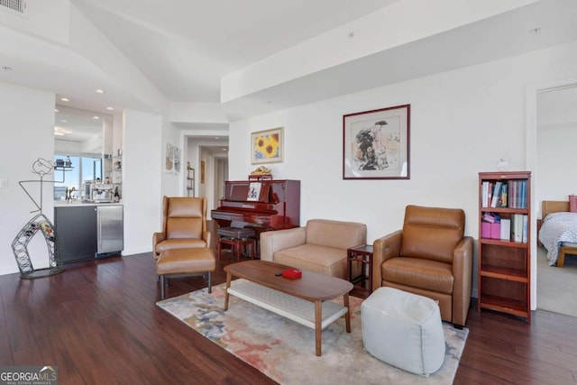 living room featuring recessed lighting, visible vents, and hardwood / wood-style flooring