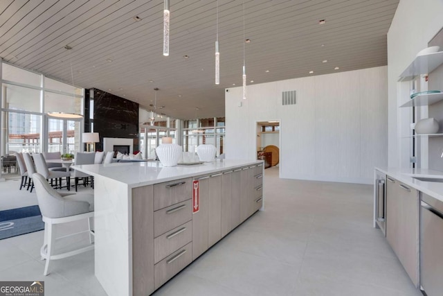 kitchen featuring visible vents, modern cabinets, open shelves, a spacious island, and wooden ceiling