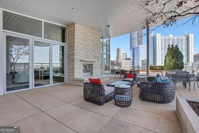 view of patio featuring a view of city and outdoor lounge area