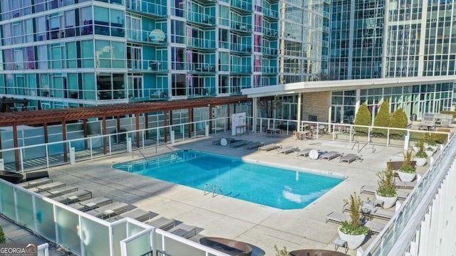 view of swimming pool featuring a patio