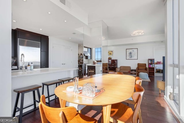 dining space with recessed lighting, visible vents, and dark wood finished floors