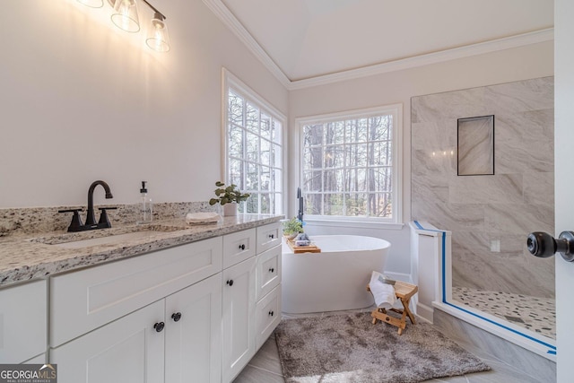 bathroom with vanity, lofted ceiling, a freestanding tub, a tile shower, and crown molding