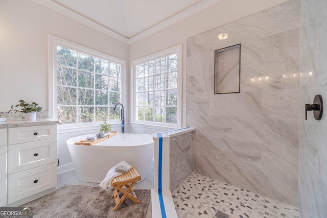 full bathroom featuring tiled shower, crown molding, and a freestanding tub