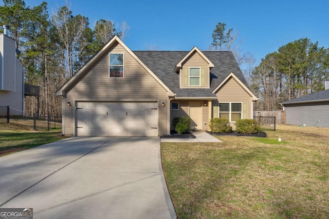 view of front of home featuring a garage, concrete driveway, a front lawn, and fence