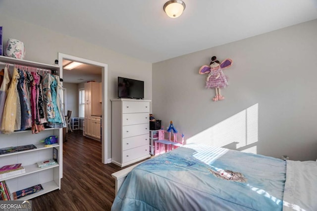 bedroom featuring dark wood-style flooring