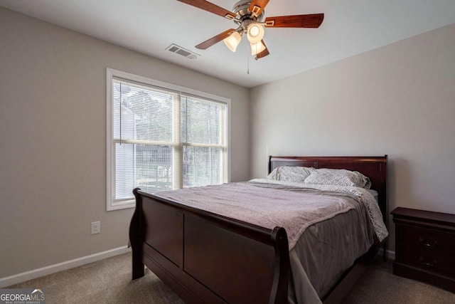 bedroom with visible vents, baseboards, ceiling fan, and carpet flooring