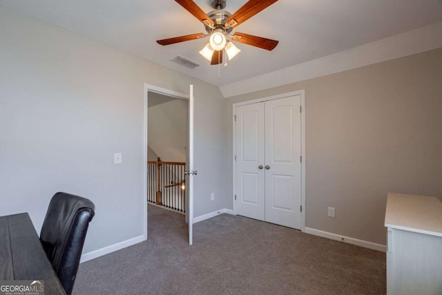 unfurnished office featuring baseboards, carpet floors, visible vents, and a ceiling fan