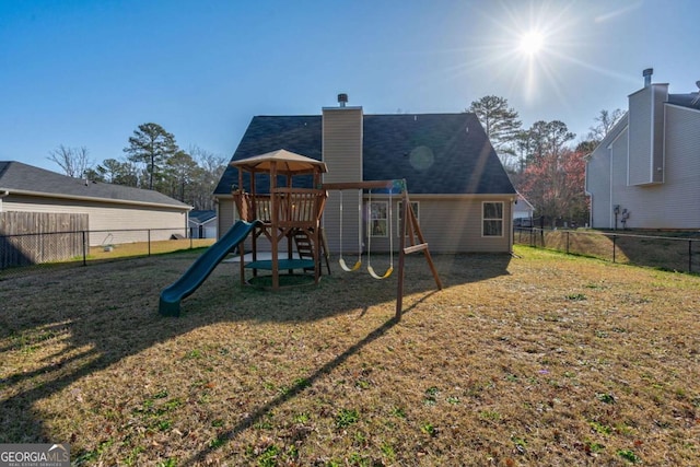 view of play area featuring a yard and fence private yard