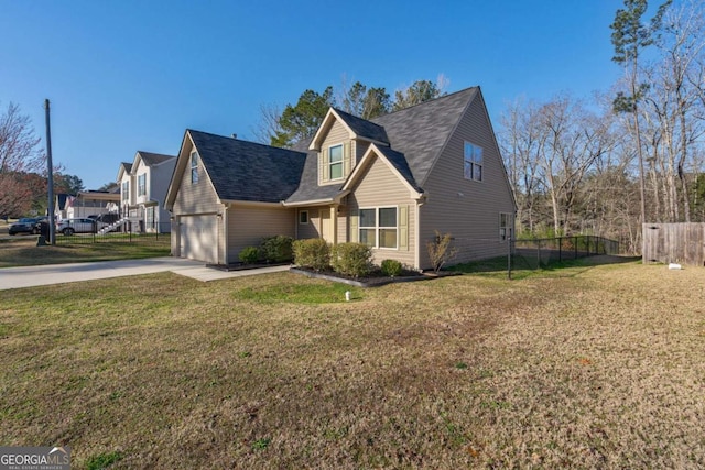 view of front of house featuring a front lawn, concrete driveway, fence, and a garage