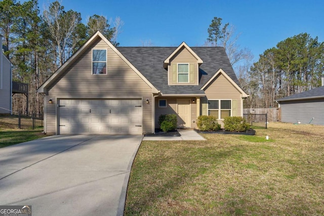 view of front of home featuring concrete driveway, a front lawn, and fence