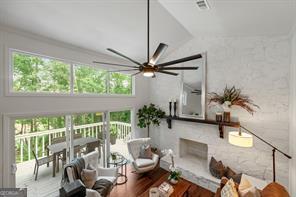 sunroom / solarium featuring ceiling fan